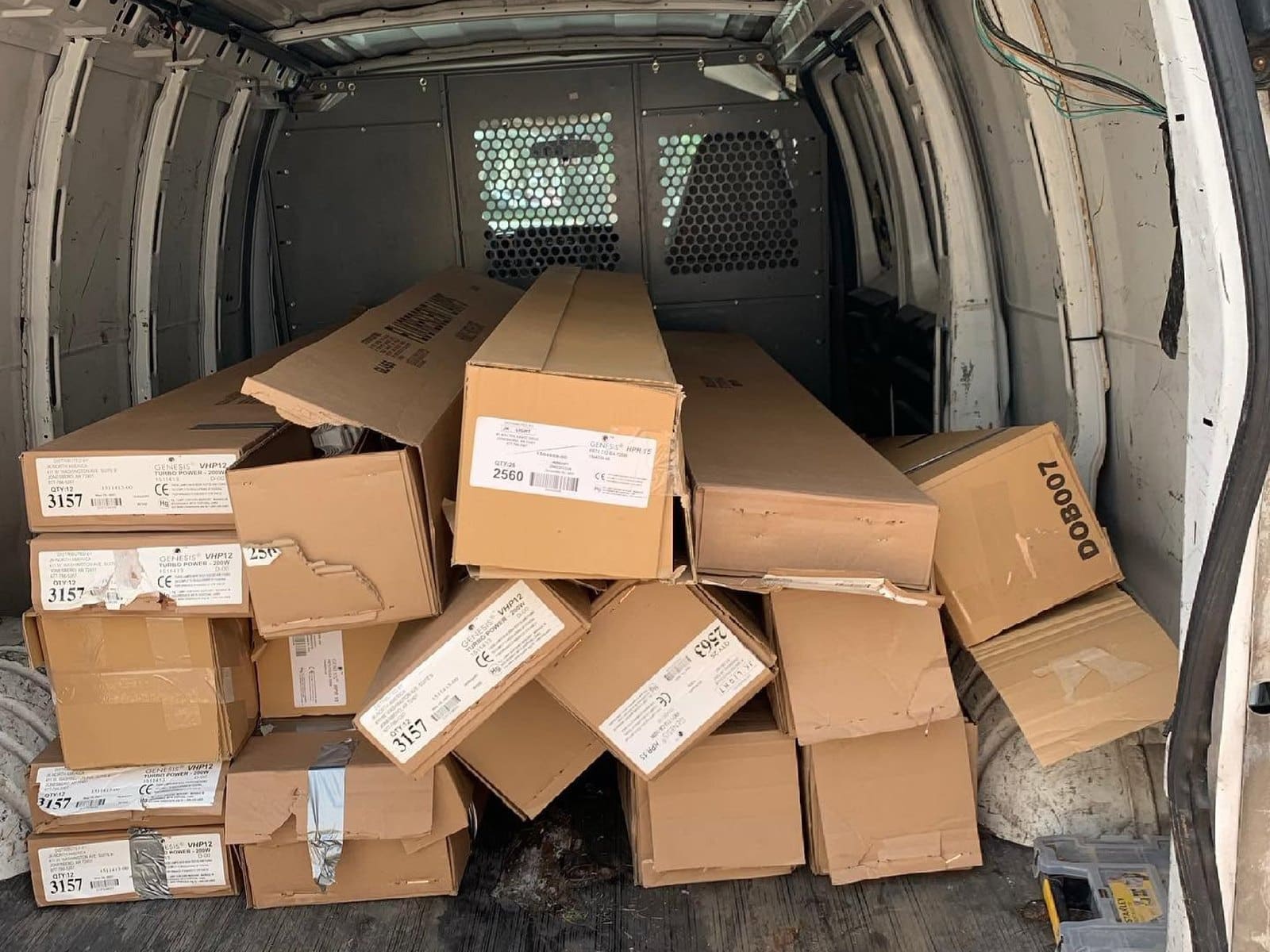 The Gem City Recycling van loaded with cartons of spent lamps